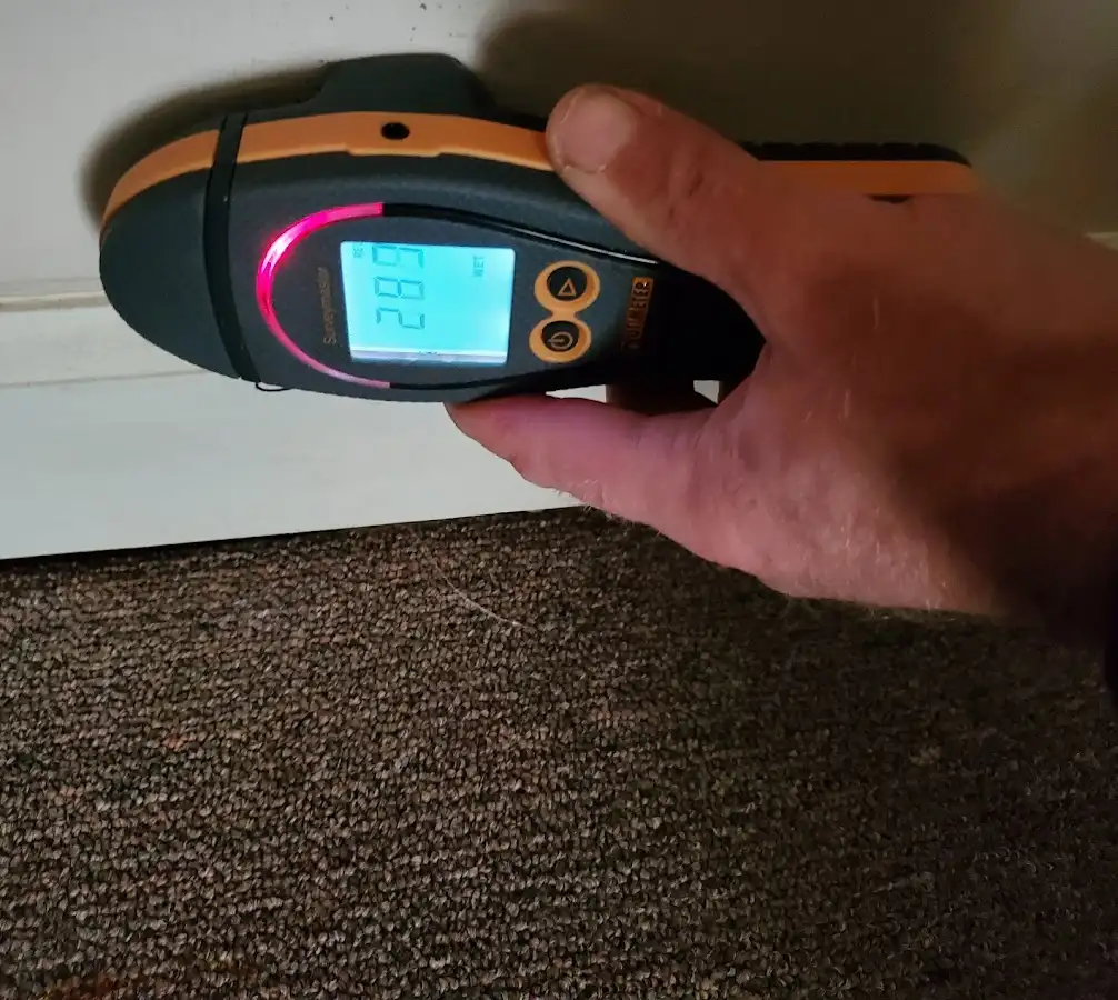 Moisture detection at baseboard during Storm Damage Restoration in Tolland